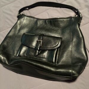 Woman’s authentic Coach purse